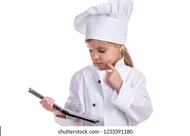 Girl Chef White Uniform Isolated On White Background. Holding The Black Ipad Screen, Thinking And Looking On It. Landscape Image