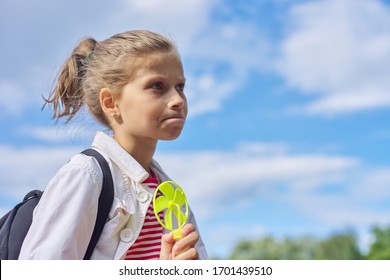 Girl Child Blonde 9, 10 Years Old In Profile, Head Closeup, Sky In Clouds Background, Copy Space