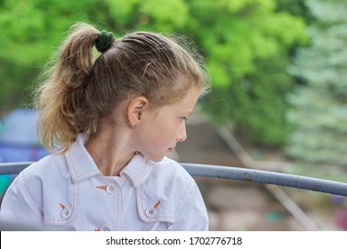 Girl Child Blonde 9, 10 Years Old In Profile, Head Closeup, Sky In Clouds Background, Copy Space