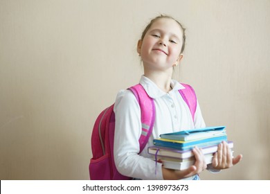 Girl Child With Books. Back To School. Cute Baby 7 Years Old With Tutorials Reading Indoor. Copy Space