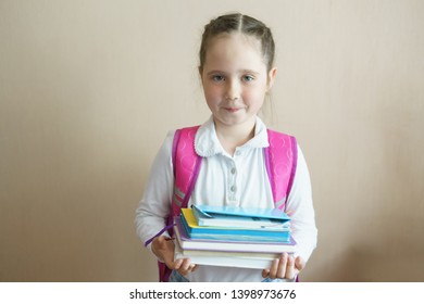 Girl Child With Books. Back To School. Cute Baby 7 Years Old With Tutorials Reading Indoor. Copy Space