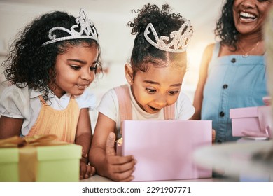 Girl child, box and wow for gift, surprise or happiness for princess at birthday in family home. Female kid, present and smile with mother, sister and happy at party with tiara, love or bond in house - Powered by Shutterstock