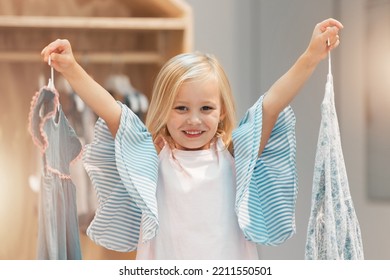 Girl Child, Choice Or Change Clothes In Fashion Brand Retail Store Shopping Sale Happy For Buying Decision At Mall. Smile, Happiness And Excited Young Kid Customer Choose Designer Clothing Dress Shop