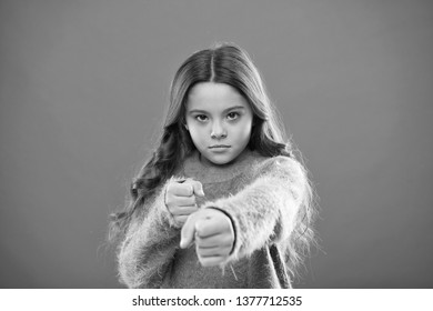 Girl Child Cute But Strong. Self Defense For Kids. Defend Innocence. How Teach Kids To Defend Themselves. Self Defense Strategies Kids Can Use Against Bullies. Girl Hold Fists Ready Attack Or Defend.