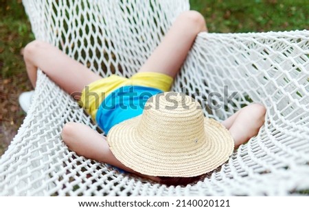 Similar – Young woman relaxing in a hammok