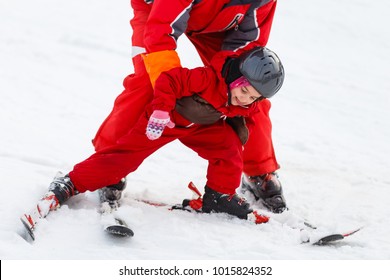 Girl Child Is Learning To Ski Get Up After A Fall She Slowly Slides On Skis In Soft Fresh Snow