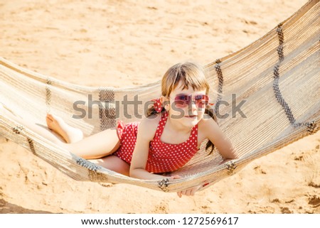 Similar – Young woman relaxing in a hammok