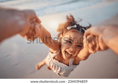 Girl child, spin and pov by ocean, portrait and smile for game, holding hands or speed in summer. Young female kid, parent and swing in air, sand or happy for family bonding, love or care in sunshine