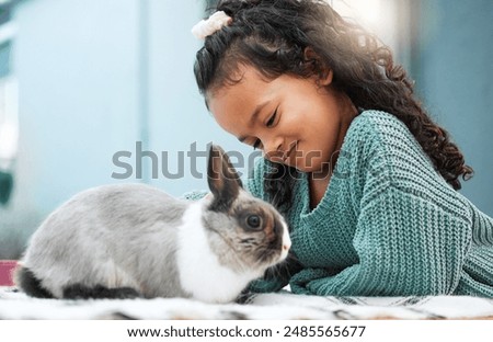 Similar – Image, Stock Photo Person playing with rabbit at home