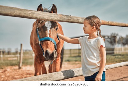 .Girl child, touch horse and outdoor with care, love and holiday at farm, countryside or zoo in summer. Young kid, pet and animal with kindness, friendly and freedom for learning in morning sunshine.