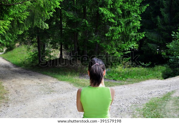 Girl with a choice\
near the forked road