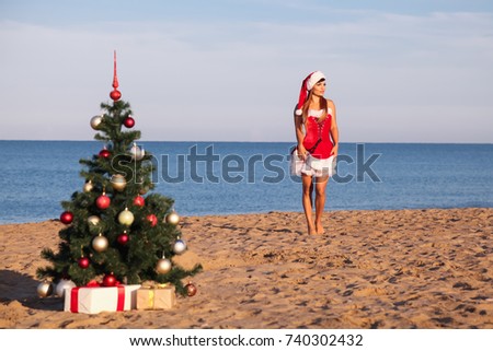 girl Christmasat a resort in the South by the sea