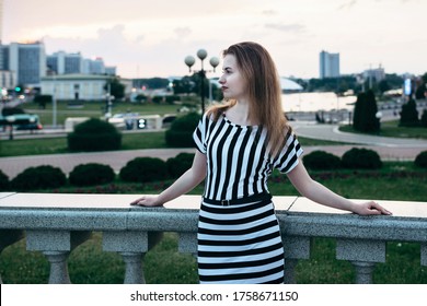 Girl In The City Photo With Blurry Background Sideways Profile