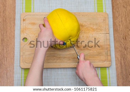 Girl cleaning her hands with pomelo, citrus on a wooden board