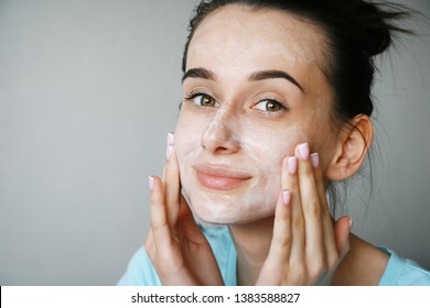 Girl Cleans Face With Facial Cleanser