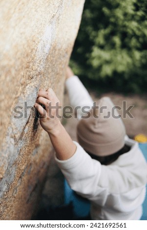 Similar – Little boy looking through the wall of a castle