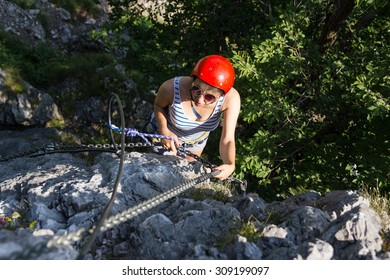 Girl Is Climbing The Via Ferrata