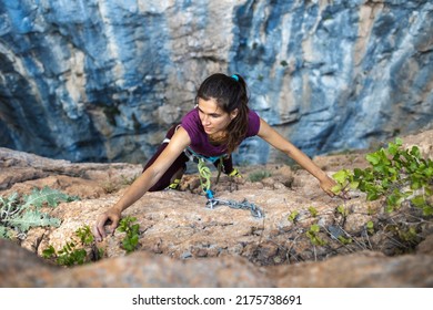 The Girl Climbs The Climbing Path. Rest At Nature. Climber Climbs To The Top Of The Mountain. Girl Goes In For Sports In Nature.