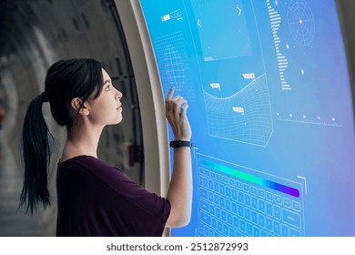 Girl coding on a interactive screen