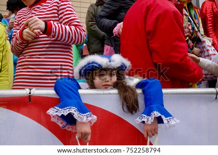 Girl from cologne at the famous carnival parade on Rose Monday.