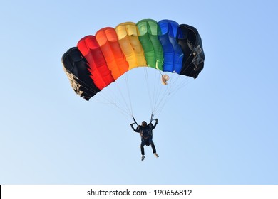 girl with colorful parachute in Thai navy parachute team
