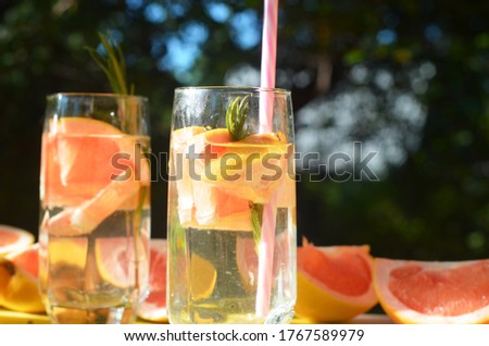 Similar – Infused fruit water cocktails and woman drinking green smoothie