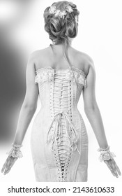 Girl In A Corset From The Back View