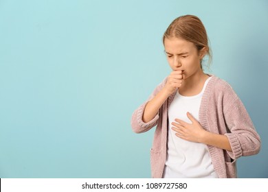 Girl Coughing On Color Background