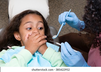 Girl covering mouth - Powered by Shutterstock