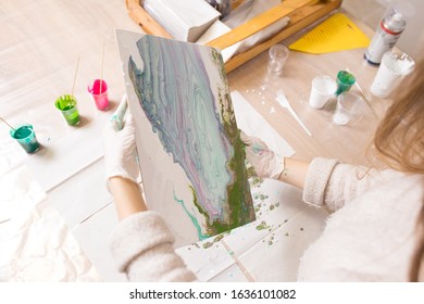 The girl creates a picture with abstraction in bright colors. - Shutterstock ID 1636101082