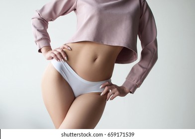 Girl In Crop Top And White Pantie Posing On White Background