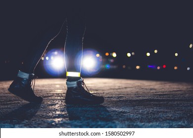 Girl Crosses The Road At Night. Reflective Bracelet. Winter Road Safety Concept.