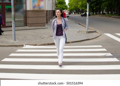 girl crossing the street on the empty crosswalk - Shutterstock ID 501516394