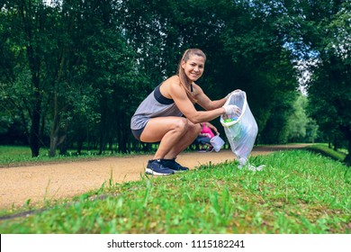 Girl crouching with garbage bag looking at camera doing plogging