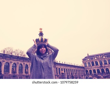 A Girl With A Crown On Her Head In Zwinger, Dresden. Forced Perspective Photography. 