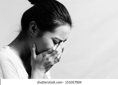Girl Crying With Hand Covering Face