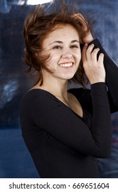 Girl With Curly Hair In A Wind Tunnel