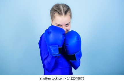 Girl Cute Boxer On Blue Background. With Great Power Comes Great Responsibility. Boxer Child In Boxing Gloves. Rise Of Women Boxers. Female Boxer Change Attitudes Within Sport. Free And Confident.