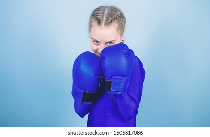 Girl Cute Boxer On Blue Background. With Great Power Comes Great Responsibility. Boxer Child In Boxing Gloves. Rise Of Women Boxers. Female Boxer Change Attitudes Within Sport. Free And Confident.