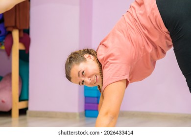 The girl dance instructor shows the elements of the act in front of the mirror. Dance training.