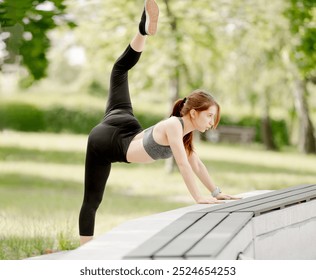 Girl Dancer Does Leg Swings In Park For Warm-Up - Powered by Shutterstock