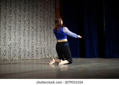 The Girl Dances On Stage. Dance Movement. Choreography Lesson. The Woman Performs Solo.