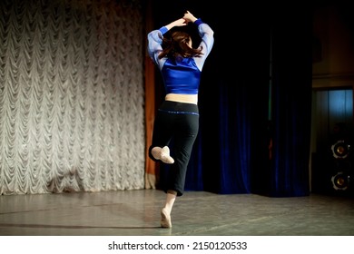 The Girl Dances On Stage. Dance Movement. Choreography Lesson. The Woman Performs Solo.