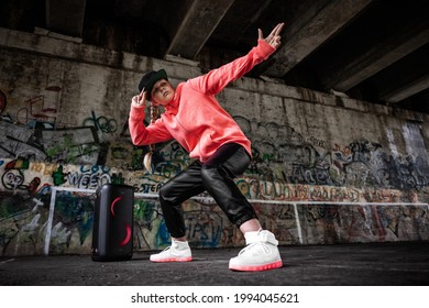 Girl dancing by hip hop music and wearing LED sneakers - Powered by Shutterstock