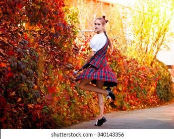 Girl dancing in the Irish dance costume