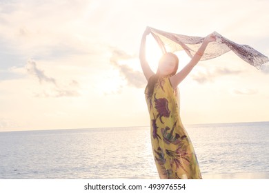 Girl Dancing On The Beach In The Sunset 