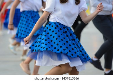 Girl Dancing In Polka Dot Blue Skirt