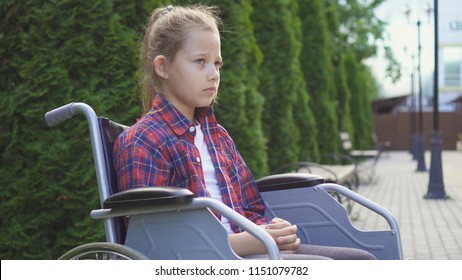 Girl is a disabled person in a wheelchair