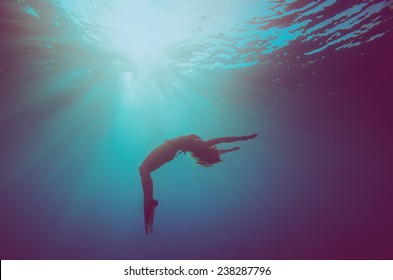 girl dive, underwater scene, vintage style - Powered by Shutterstock