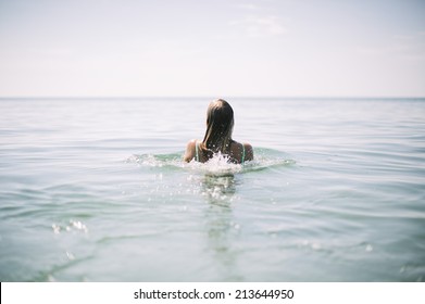 girl diving out of the water